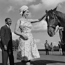 Queen Elizabeth II pats the head of a horse, watched by Emperor Haile Selassie (1892 - 1975) during her royal tour of Ethiopia, February 1965. 