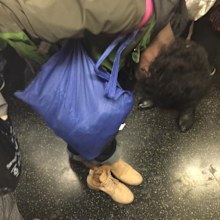 A woman in the US gave up her shoes to a homeless woman on the train who broke down crying at the kind gesture. (Facebook)