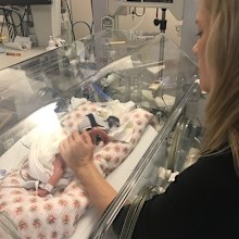Sam Squiers watches daughter Imogen in NICU after her premature birth.