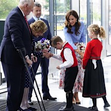Princess Mary business conference blue shirt and floral skirt