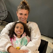 Piper Duck with her little sister, who will never doubt that women can play sport.