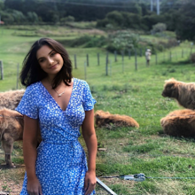Woman posing in a pasture