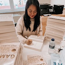 Ana Huang signs books from her Twisted Love series.