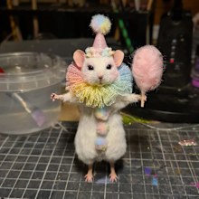 A clown-themed taxidermy mouse created by Brook Wright.