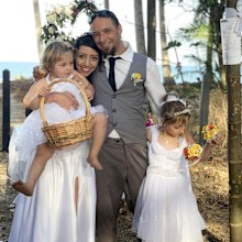 Caroline Thomas and her husband Julian Simon, pictured on their wedding day in Australia with their two children.