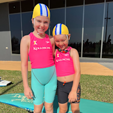 Mila Park poses in her swimmers with her little brother.