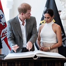 Prince Harry and Meghan, Duchess of Sussex sign the city's guest book at the town hall in Duesseldorf, Germany, Tuesday, September 6, 2022. 