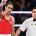 PARIS, FRANCE - AUGUST 1: Algeria's Imane Khelif (in red) during the Women's 66kg preliminary round match against Angela Carini of Italy (in blue) on day six of the Olympic Games Paris 2024 at North Paris Arena on August 01, 2024 in Paris, France. (Photo by Fabio Bozzani/Anadolu via Getty Images)