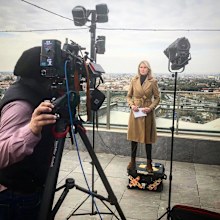 Amelia Adams reporting from abroad as a foreign correspondent.