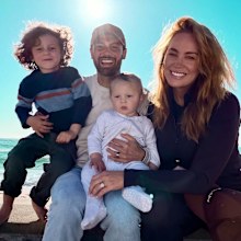 MAFS Jules Robinson and Cam Merchant pose as a family of four with sons Ollie and Carter. 