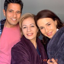 Roj Torabi with her parents.
