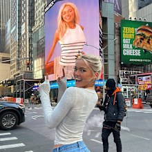 Livvy Dunne shows off an ad she starred in on a large billboard.