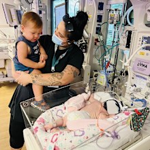 Forrest meeting baby sister Luna in hospital.