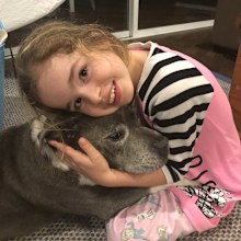Eva Kalpidis snuggled up to her dog.