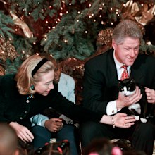 President Clinton holds Socks the cat as he and first lady Hillary Clinton host Washington area elementary school children at the White House in 1996
