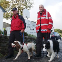 South Yorkshire Police dog handler Martin Grime with dog Eddie (left) in the North Cornwall village of Boscastle conducting a sweep search for possible victims of the 2004 flood which swept through the village.