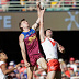 Harris Andrews of the Lions and Logan McDonald of the Swans compete for the ball during round 19.