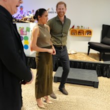 Prince Harry, Duke of Sussex and Meghan, Duchess of Sussex are shown artwork by army reservist Keith Ross (2nd L) at the Australian National Veterans Arts Museum (Anvam) in Southbank on April 14, 2026 in Melbourne, Australia. 