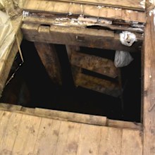 An open cellar found behind the counter of the general store.