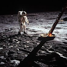 Astronaut Buzz Aldrin walks on the moon.