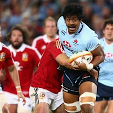 Will Skelton of the Waratahs is tackled against the British and Irish Lions at Allianz Stadium in 2013.
