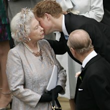Prince Harry kisses his grandmother Queen Elizabeth II while Prince Philip looks on after the wedding of Peter Phillips to Autumn Kelly, at St George's Chapel in Windsor Castle on May 17, 2008 in Windsor, England. 