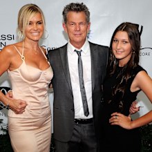 Bella Hadid with mum Yolanda and then-stepdad David Foster arrive at the Andre Agassi Foundation for Education's 15th Grand Slam for Children benefit concert at the Wynn Las Vegas October 9, 2010 in Las Vegas, Nevada. 