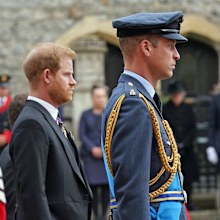 Prine Harry, The Duke of Sussex and Prince William, Prince of Wales follow the State Hearse carrying the coffin of Queen Elizabeth II, draped in the Royal Standard with the Imperial State Crown and the Sovereign's Orb and Sceptre, as it arrives at the Committal Service held at St George's Chapel in Windsor Castle on September 19, 2022.