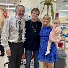 Elizabeth poses with her husband and daughter Sophia in hospital.