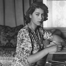 Queen Elizabeth II (as Princess Elizabeth) writing at her desk in Windsor Castle, Berkshire.  (Photo by Lisa Sheridan/Studio Lisa/Getty Images)