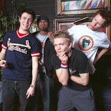 399775 06: (L-R) Sum 41 band members Steve Jocz, Dave Baksh, Deryck Whibley, and Cone McCaslin pose backstage January 18, 2002 before performing at the House of Blues in Las Vegas, NV. The band is currently on tour to promote their new album, "All Killer No Filler." (Photo by Scott Harrison/Getty Images)