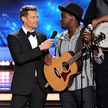 Ryan Seacrest and C.J. Harris onstage during Fox's "American Idol" XIII Finale at Nokia Theatre L.A. Live on May 21, 2014 in Los Angeles, California.