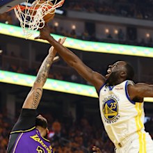 Draymond Green competes with Anthony Davis in the NBA playoffs.