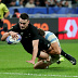 Will Jordan of New Zealand scores his team's seventh try.