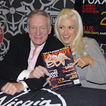 Hugh Hefner and Holly Madison  sign the November 2005 Issue of Playboy in New York in 2005.