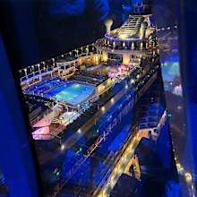 A bird's-eye view of the ship lit up at night from the North Star.