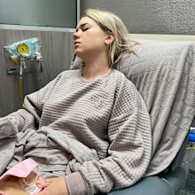 Ella Collings in hospital during an endometriosis flare up.