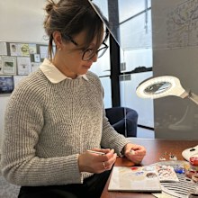 Emily Geelen paints a prosthetic eye at Artificial Eyes in West Perth.