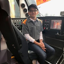 Alec on the driver's seat of a Sydney train. 