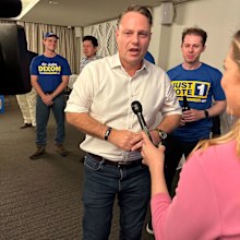 Brisbane Lord Mayor Adrian Schrinner arrives at the LNP's election night function after being re-elected for another four years.