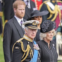 King Charles III, Camilla, the Queen Consort, Meghan, Duchess of Sussex, and Prince Harry watch as the coffin of Queen Elizabeth II is placed into the hearse following the state funeral service in Westminster Abbey in central London Monday Sept. 19, 2022. 