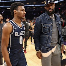 PHOENIX, ARIZONA - DECEMBER 11: Bronny James #0 of the Sierra Canyon Trailblazers and father LeBron James of the Los Angeles Lakers walk off the court following the Hoophall West tournament at Footprint Center on December 11, 2021 in Phoenix, Arizona. (Photo by Christian Petersen/Getty Images)