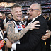 Collingwood Magpies CEO Craig Kelly hugs Jordan De Goey of the Magpies after winning the 2023 AFL Grand Final.