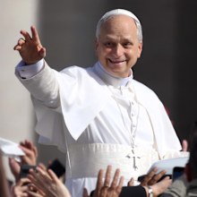Pope Leo XIV waves as he arrives ahead of the Inauguration Mass of Pope Leo XIV in St Peter's Square.