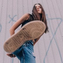 Woman stomping down, woman above