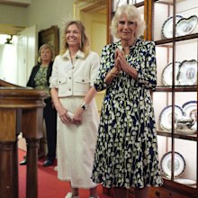 LONDON, ENGLAND - JULY 9: Queen Camilla accompanied by author Adele Parks, hosts community volunteers and authors to celebrate the National Literacy Trust charity's 30th anniversary, at Clarence House on July 9, 2024 in London, England. (Photo by Yui Mok - WPA Pool/Getty Images)