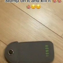 A social media image of a phone in a locked case, saying 'stomp on it and kill it'.