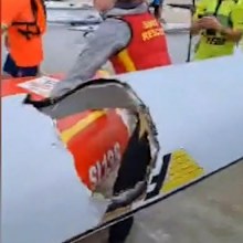 Footage of Adelaide shark attack during surf ski race.