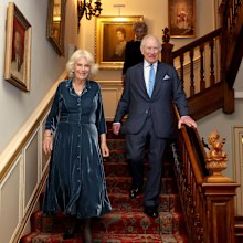 LONDON, ENGLAND - MARCH 25: King Charles III and Queen Camilla walk down the stairs during a reception to mark the launch of the Queen's reading room medal at Clarence House on March 25, 2025 in London, England. Queen Camilla, accompanied by King Charles III, The Duchess of Gloucester, and distinguished authors along with members of the literary community, came together to celebrate the continued efforts of The Queen's Reading Room and its mission to inspire greater reading among people. (Photo 