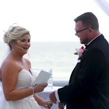 Bride and groom interrupted by bird at wedding